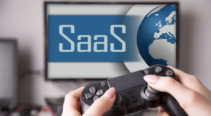A tv with background saying "SaaS" and man with a video game console in hand